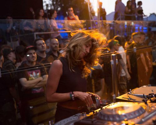 girl spinning the decks at a music festival